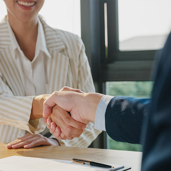 close up of two people giving a handshake