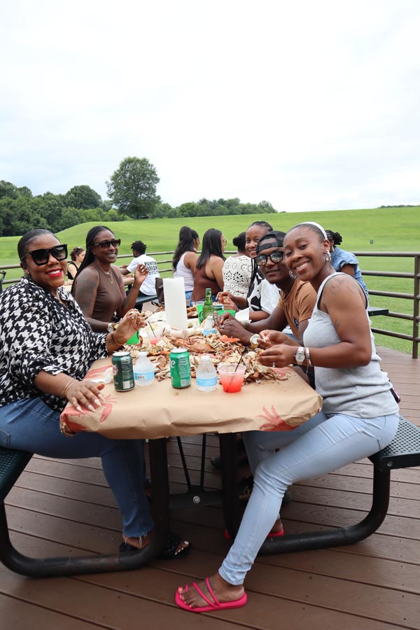 The Crane Team of Fairway enjoying a crab feast work event in 2025