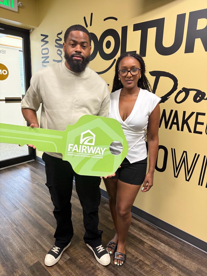 family celebrating mortgage closing