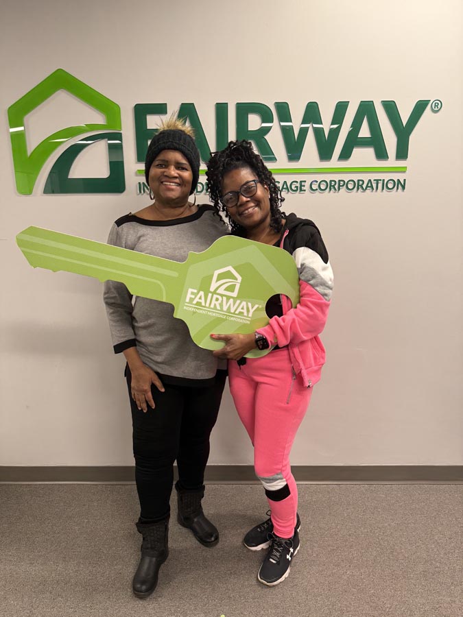 family celebrating mortgage closing