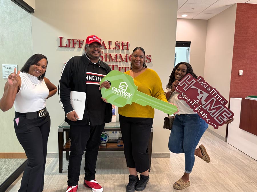 family celebrating mortgage closing